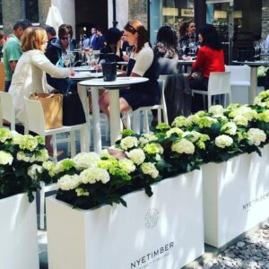 people enjoying wine tasting at an event