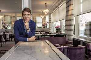 sommelier looking at camera in wine bar